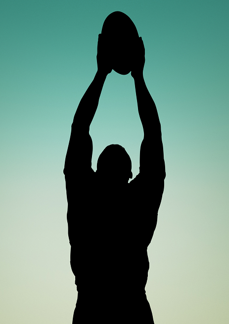male rugby player catching the ball silhouette